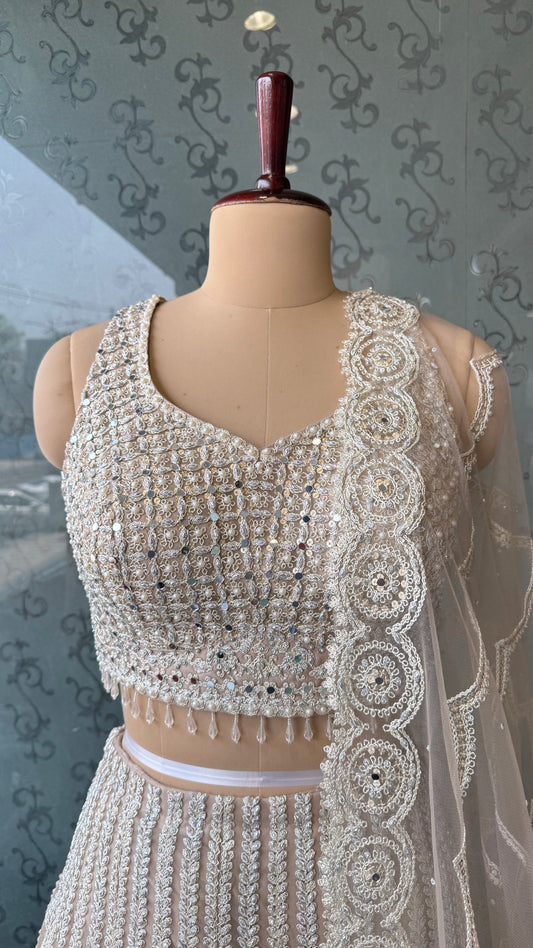 Luxury ivory Heavy Embroidered Net Lehenga Choli with Mirror & Thread Work