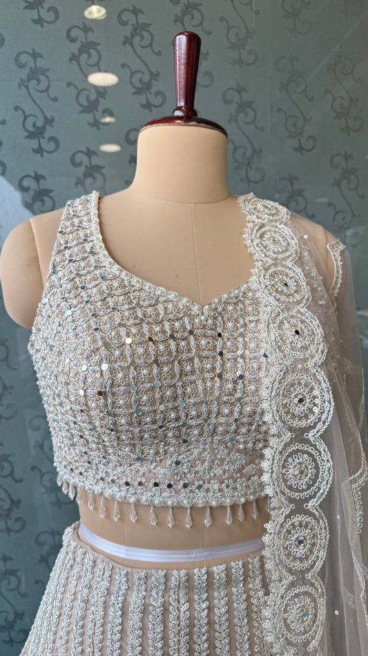 Luxury ivory Heavy Embroidered Net Lehenga Choli with Mirror & Thread Work