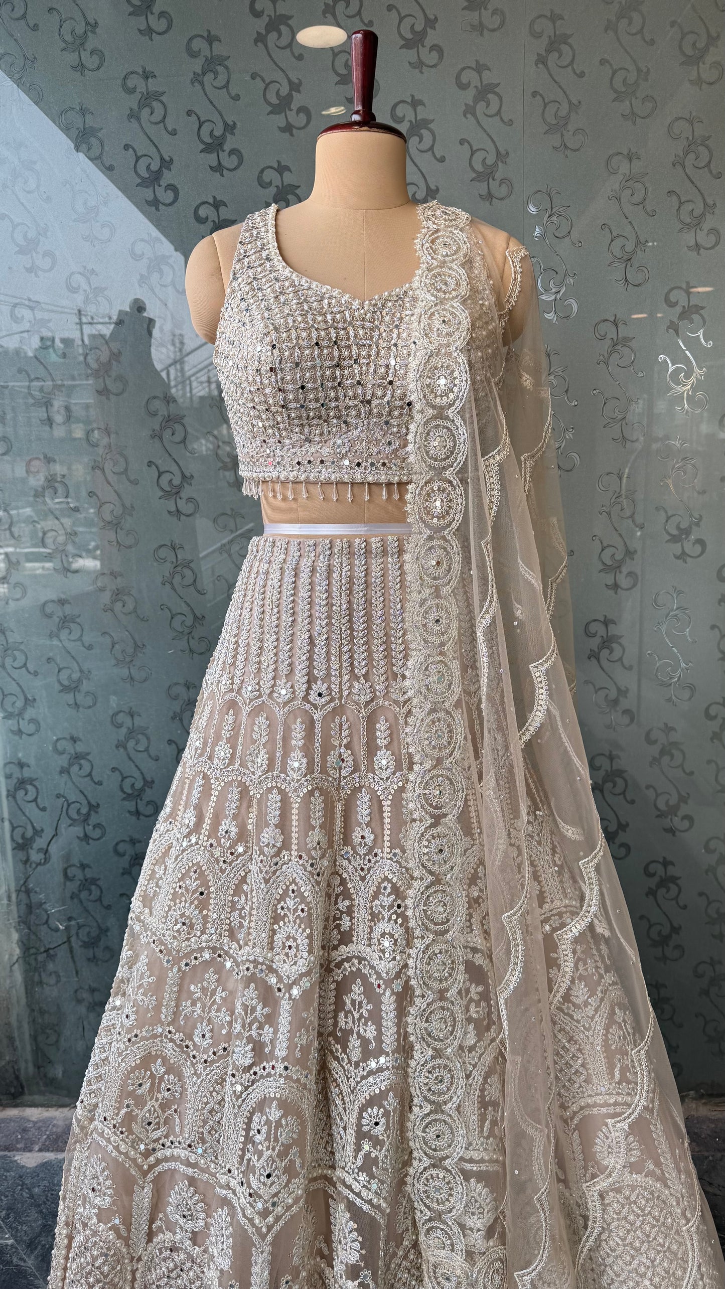 Luxury ivory Heavy Embroidered Net Lehenga Choli with Mirror & Thread Work